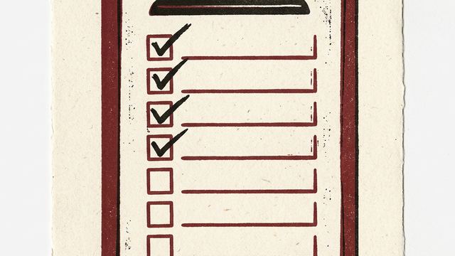 A clipboard holding a checklist with several ticked boxes